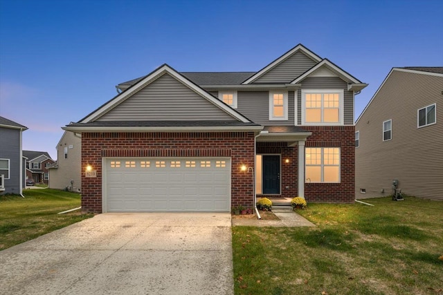 view of front of house featuring a garage and a lawn