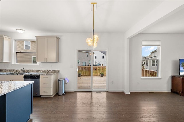 kitchen featuring light stone countertops, dark hardwood / wood-style flooring, decorative light fixtures, and stainless steel dishwasher