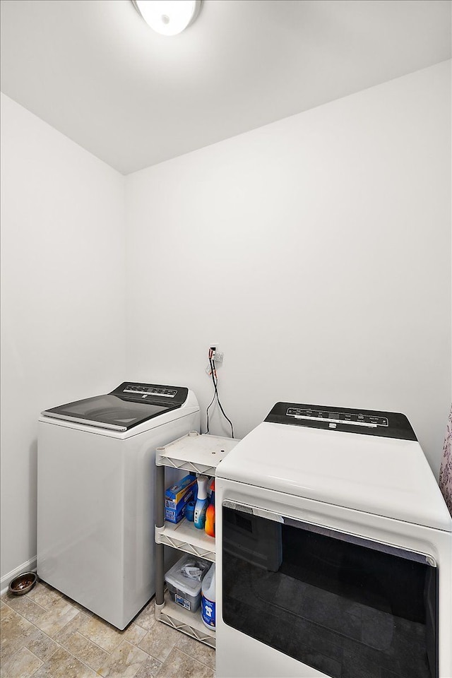 laundry area with independent washer and dryer