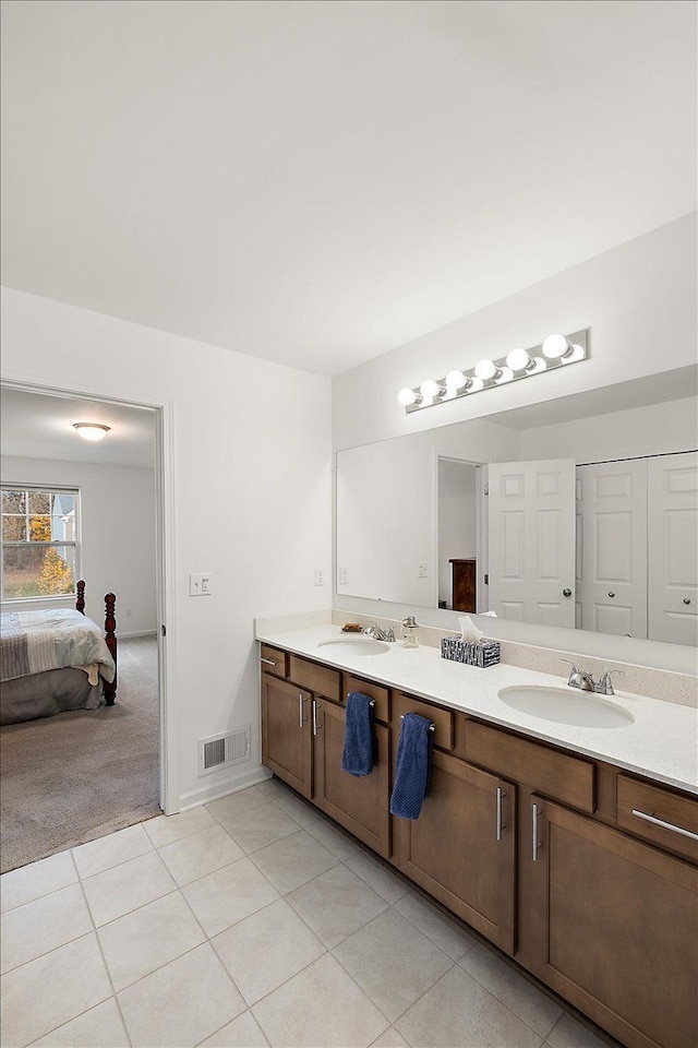 bathroom featuring tile patterned floors and vanity