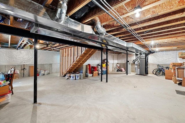 basement with heating unit and water heater