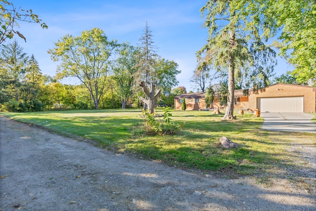 view of front of house with a garage and a front yard