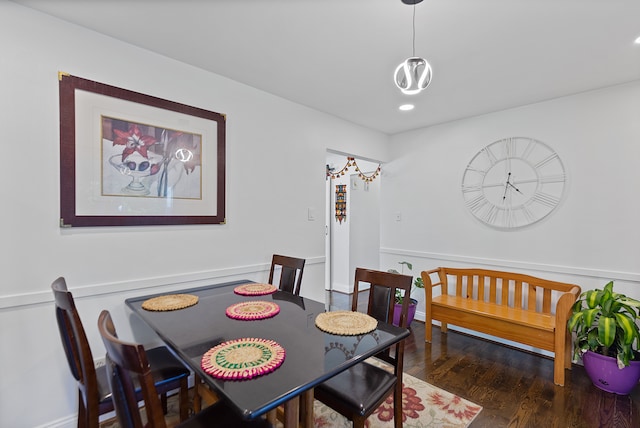 dining room with dark hardwood / wood-style flooring