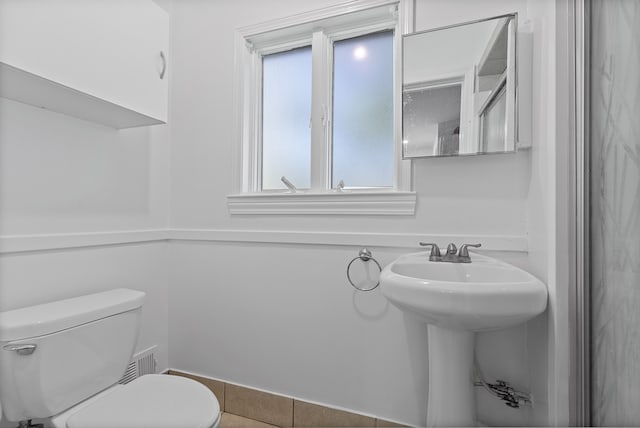 bathroom with tile patterned floors and toilet