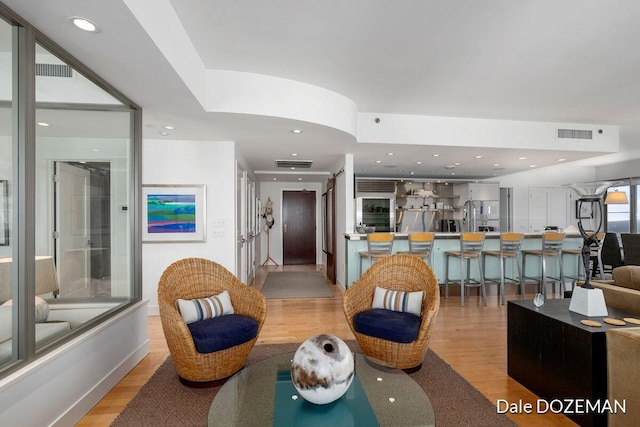 living room with light hardwood / wood-style flooring