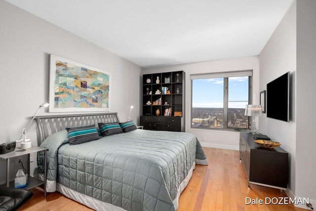 bedroom with light hardwood / wood-style floors