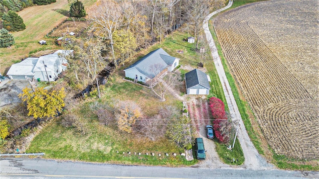 birds eye view of property with a rural view