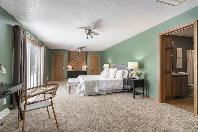 carpeted bedroom featuring baseboards, ceiling fan, visible vents, and a textured ceiling