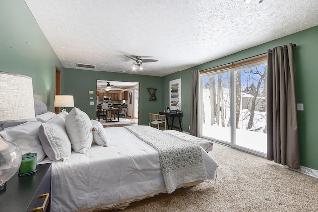 bedroom with visible vents, carpet flooring, ceiling fan, a textured ceiling, and access to outside