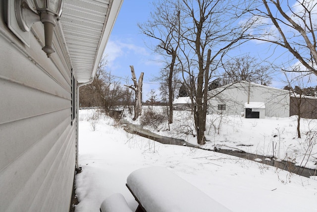 view of yard covered in snow