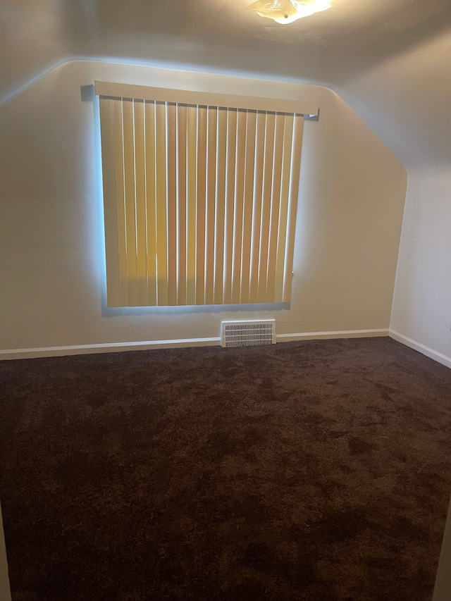 bonus room featuring carpet floors and lofted ceiling