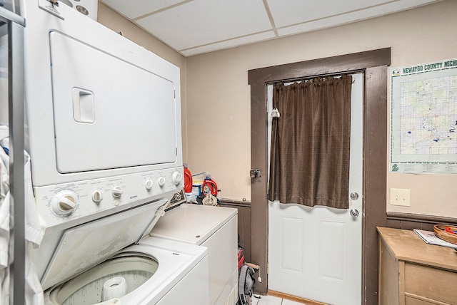 washroom featuring stacked washer / dryer