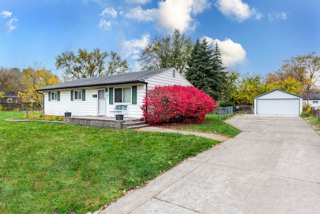 view of front of property featuring a front lawn, an outdoor structure, and a garage