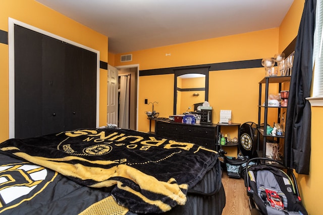 bedroom featuring hardwood / wood-style floors