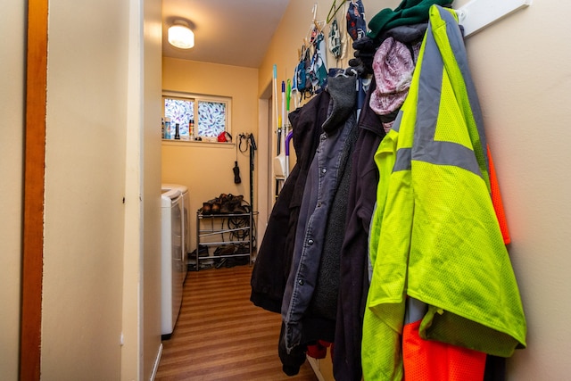 interior space with washer and clothes dryer and wood-type flooring