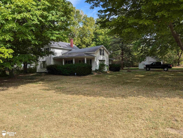 view of side of home featuring a lawn