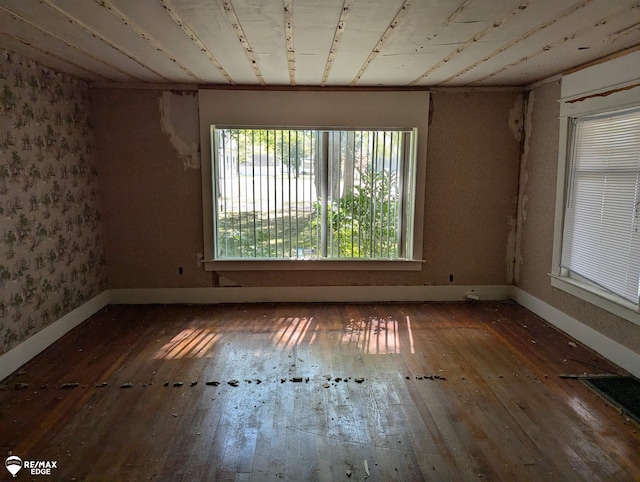 spare room with dark wood-type flooring