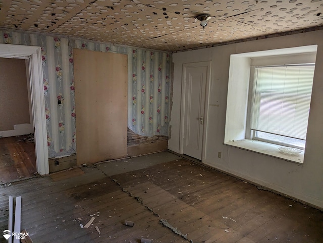 spare room with wood-type flooring