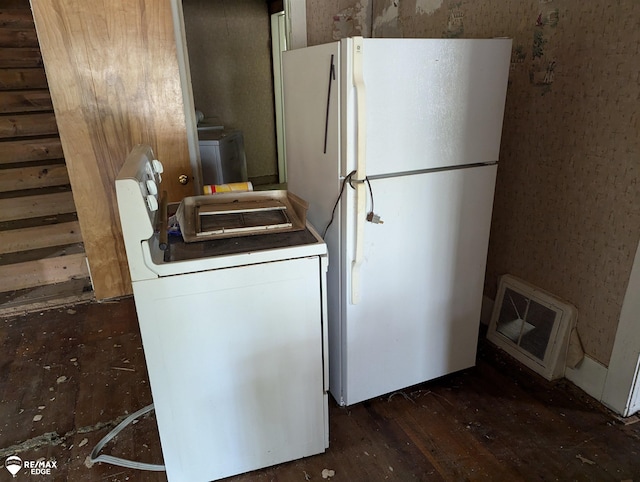 kitchen with washer / clothes dryer, white fridge, and dark wood-type flooring