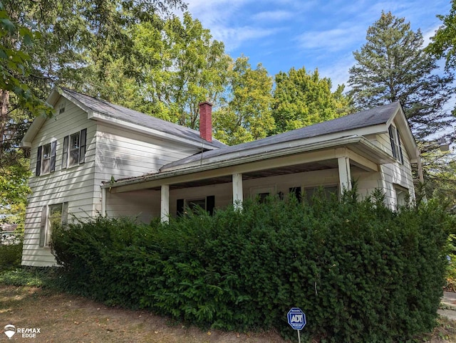 view of home's exterior featuring covered porch