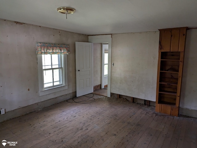 unfurnished room with light hardwood / wood-style floors