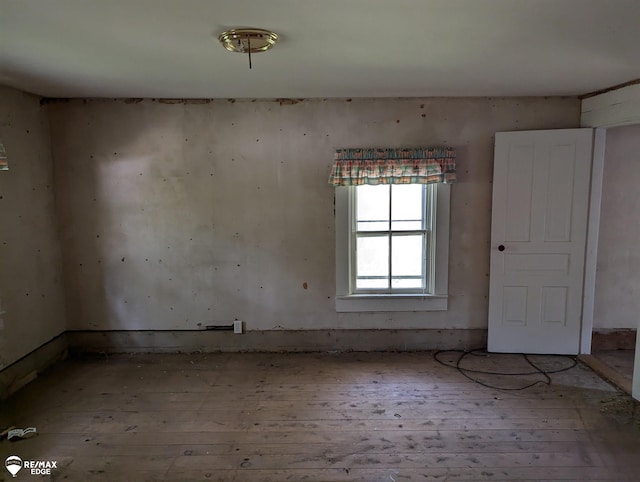 unfurnished room with light hardwood / wood-style flooring