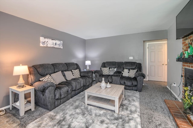 carpeted living room featuring a brick fireplace