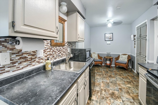 kitchen featuring tasteful backsplash, white cabinetry, sink, and appliances with stainless steel finishes