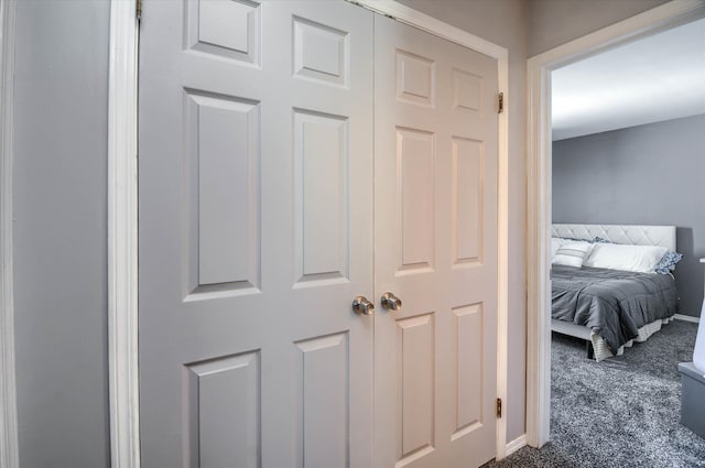 interior space with dark colored carpet