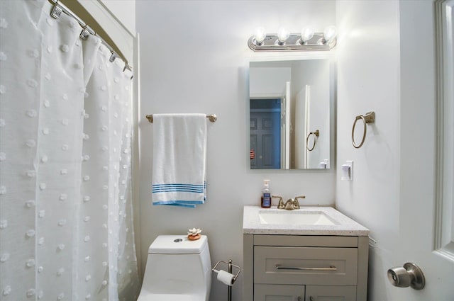 bathroom featuring vanity, toilet, and walk in shower