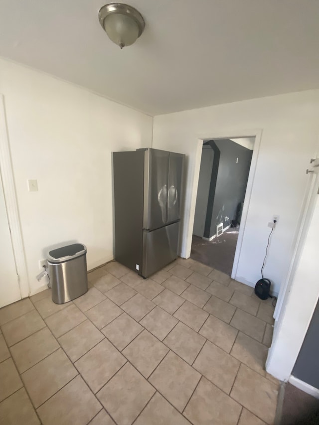 washroom with light tile patterned floors