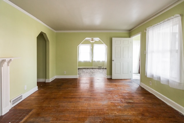 interior space featuring dark hardwood / wood-style floors, ceiling fan, and crown molding