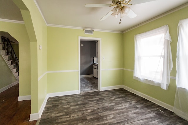 unfurnished room with dark hardwood / wood-style floors, ceiling fan, and ornamental molding