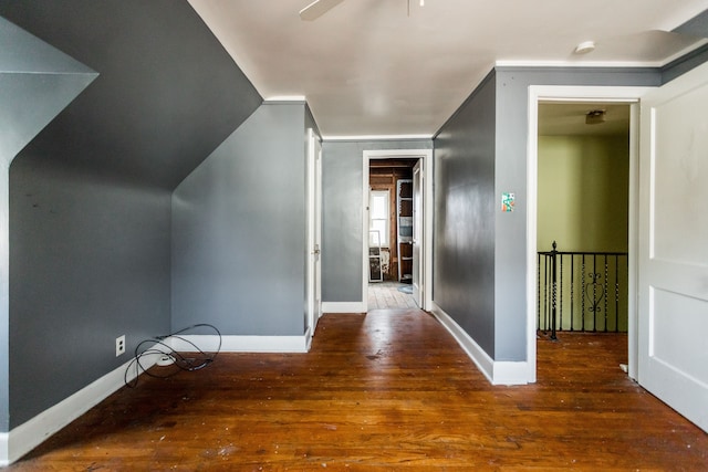 additional living space featuring ceiling fan and dark wood-type flooring