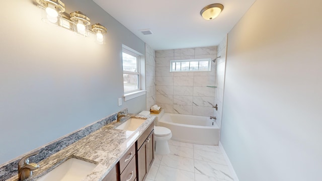 full bathroom featuring vanity, toilet, and tiled shower / bath