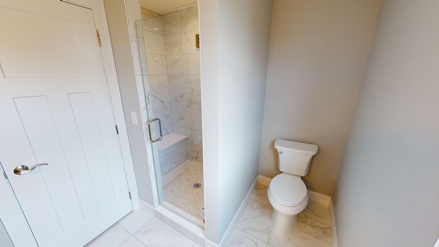 bathroom with toilet and a shower with door