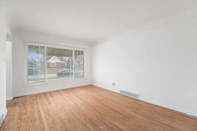 spare room featuring light hardwood / wood-style flooring