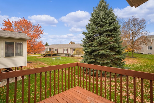 deck featuring a lawn