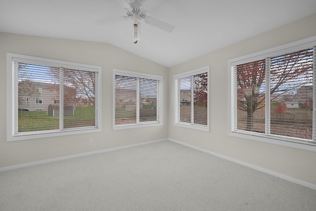 unfurnished sunroom featuring ceiling fan and lofted ceiling