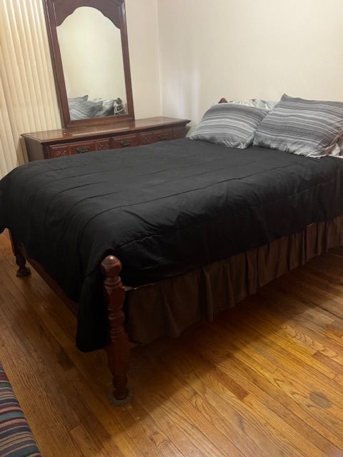 bedroom featuring wood finished floors