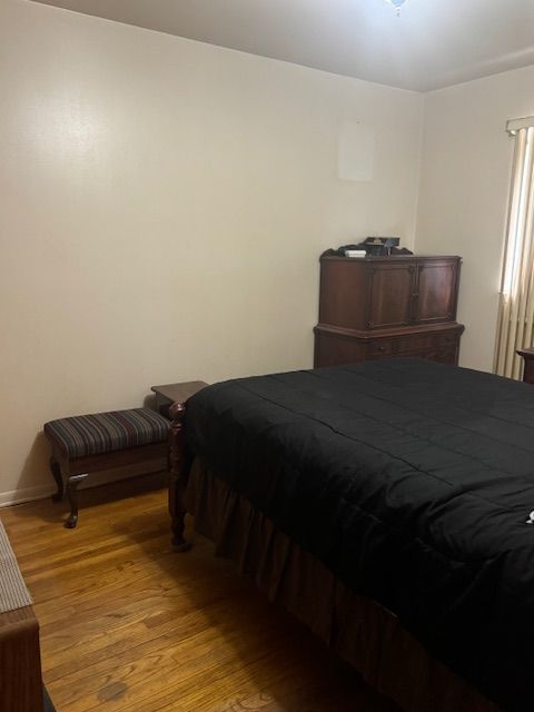 bedroom with light wood-style flooring