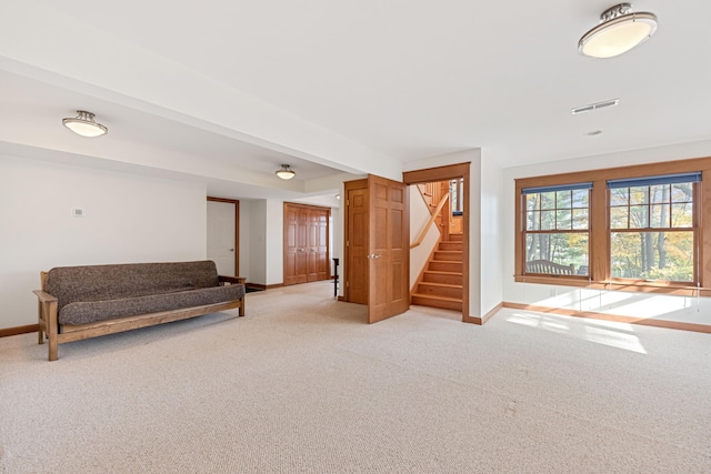 unfurnished room featuring carpet and beam ceiling