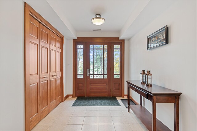 5722 Dunham Path, Stevensville, MI 49127 - foyer entrance featuring light tile patterned floors and baseboards