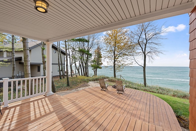 wooden terrace with a water view