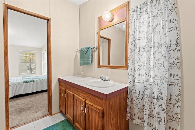 bathroom with tile patterned flooring, vanity, and a shower with shower curtain