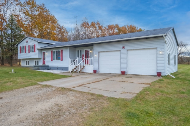 view of front of house featuring a front lawn and a garage