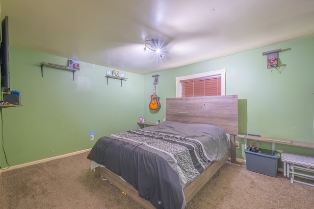 bedroom featuring light colored carpet