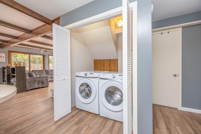 washroom featuring washer and dryer and light hardwood / wood-style flooring