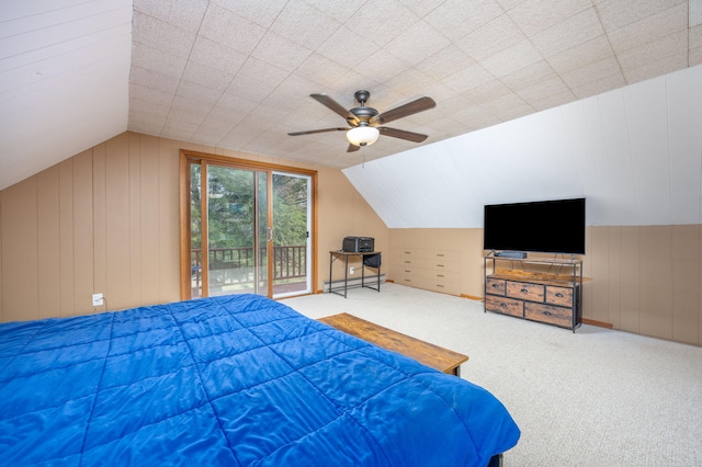 carpeted bedroom featuring ceiling fan, access to exterior, and lofted ceiling