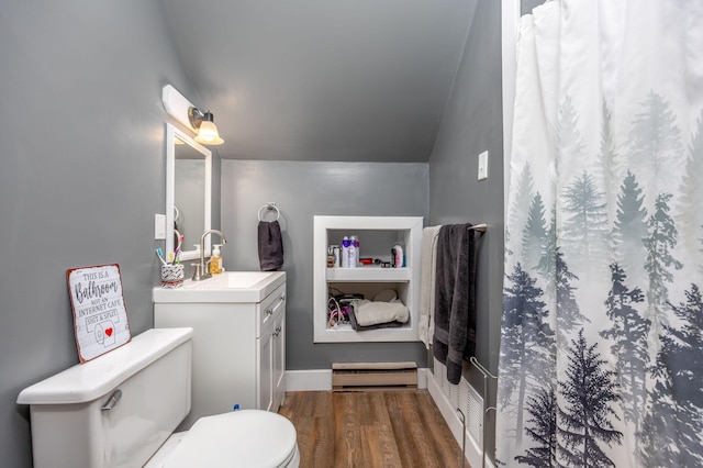 bathroom featuring hardwood / wood-style floors, vanity, lofted ceiling, toilet, and a baseboard radiator